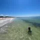 person swimming on a beach on north captiva