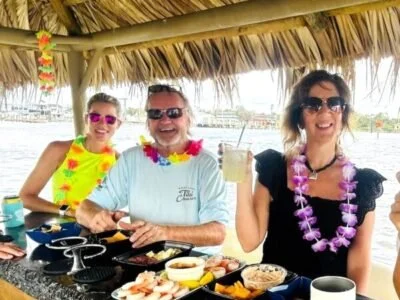 Tiki patrons on boat eathing food